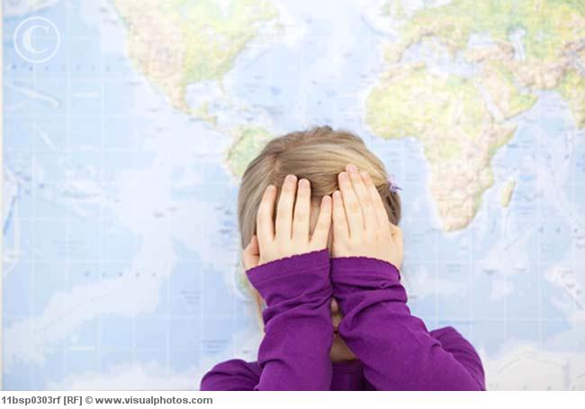 young girl hiding face with hands